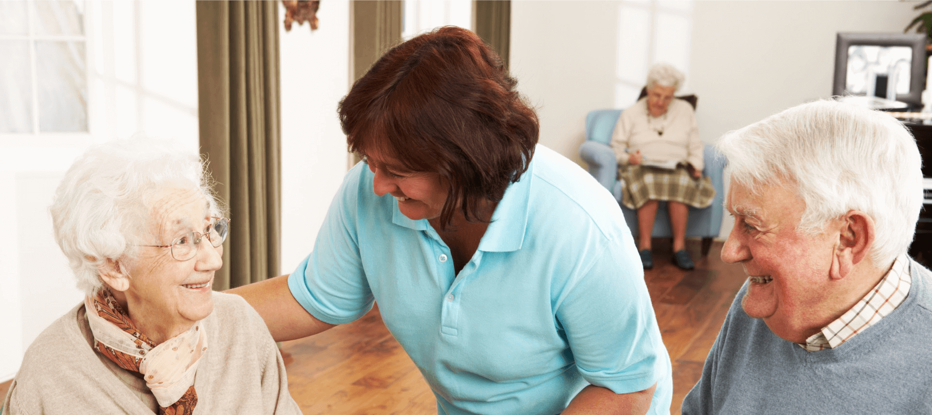 caregiver smiling to elders