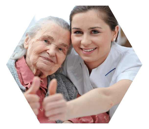 nurse and old woman showing their thumbs up